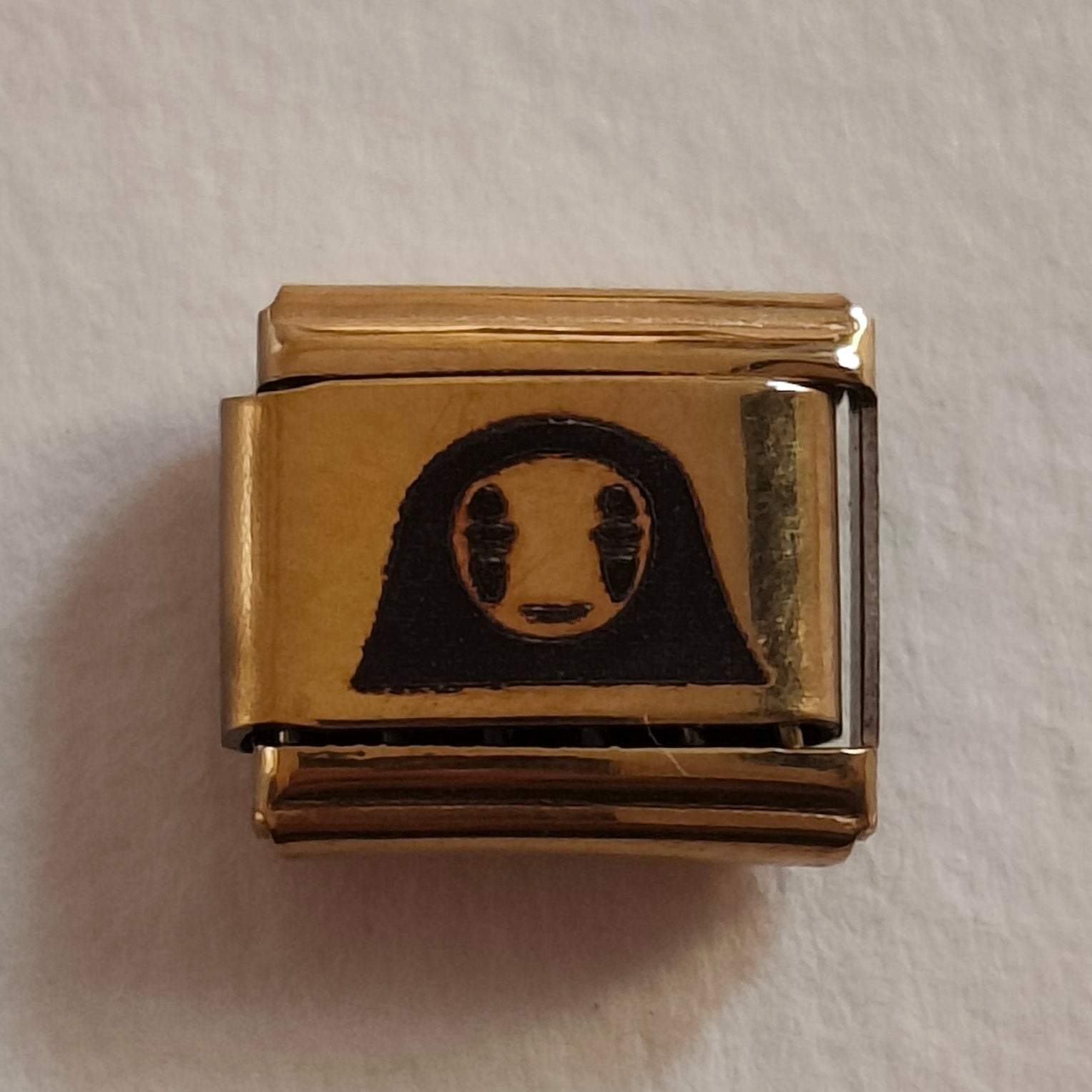 No Face Gold Charm
