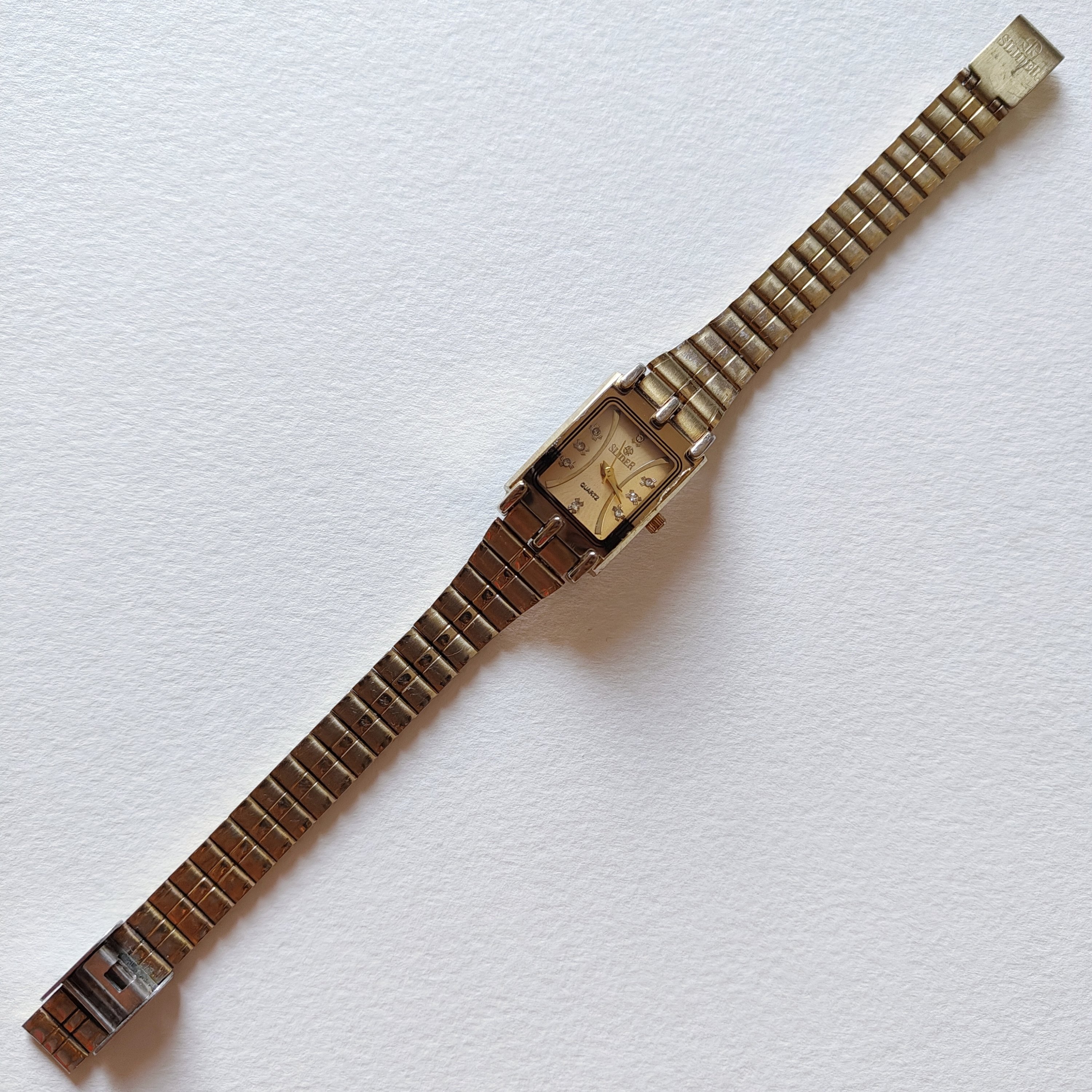 Slider gold watch