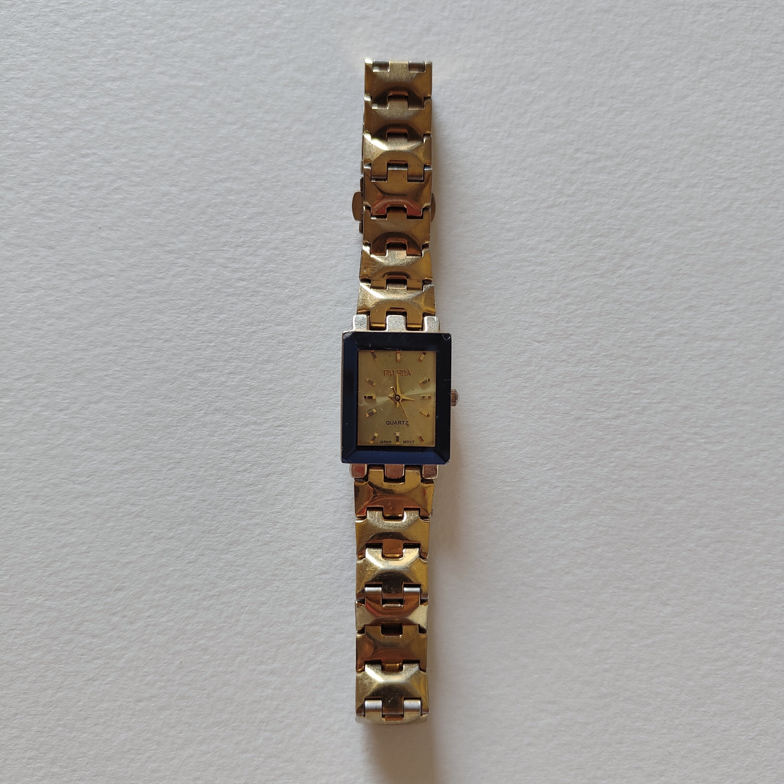 Blue frame gold watch